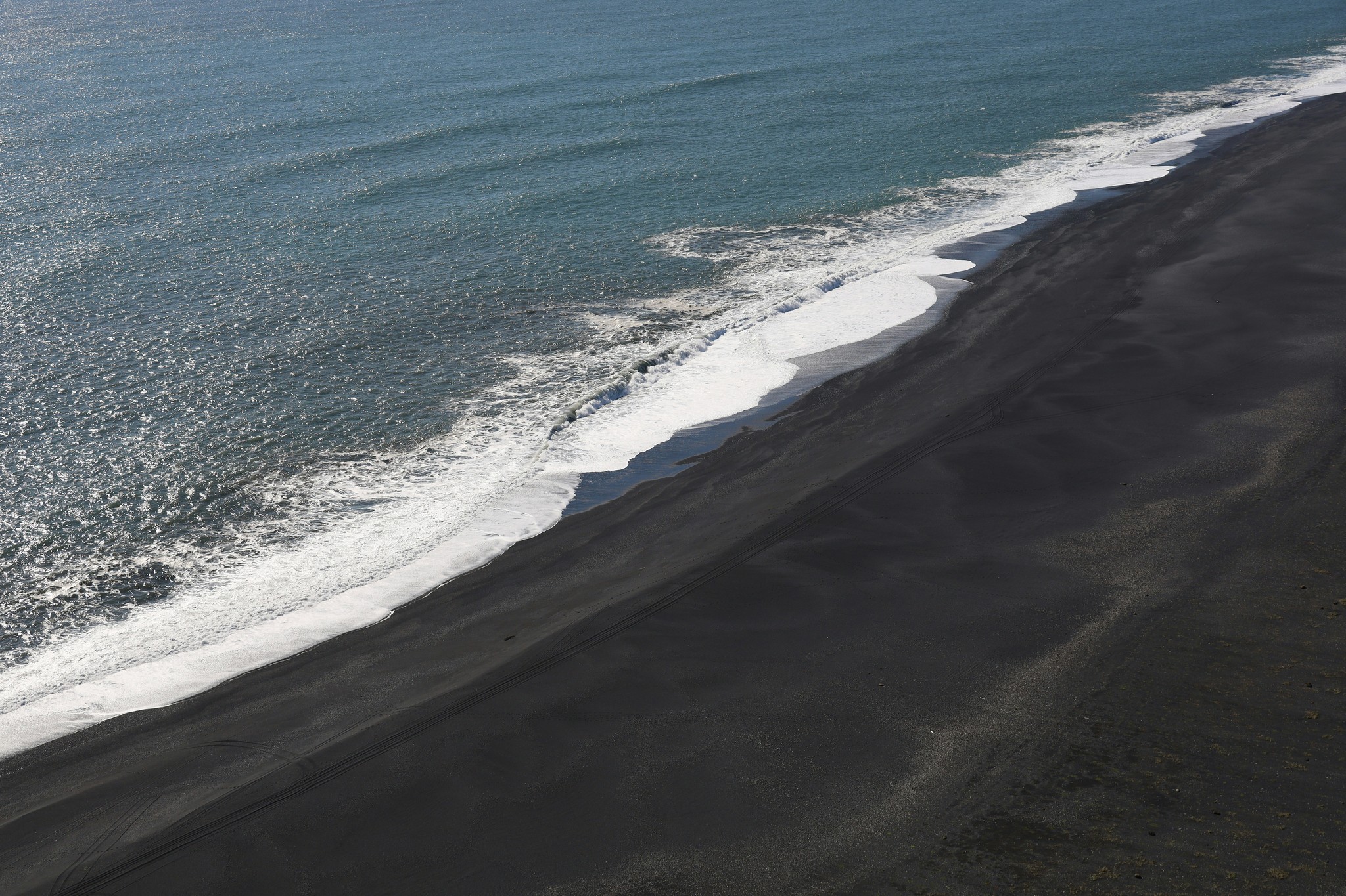 Quiet stretch of black sand beach along Iceland’s South Coast.