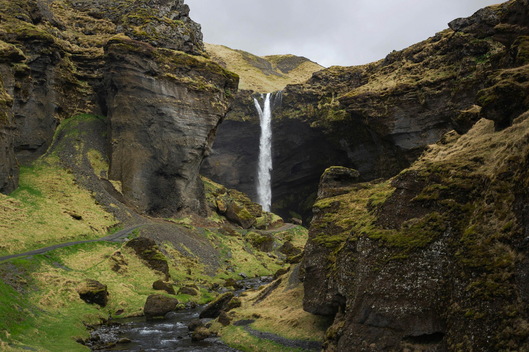 Kvernufoss Waterfall tucked inside a narrow gorge in South Iceland.