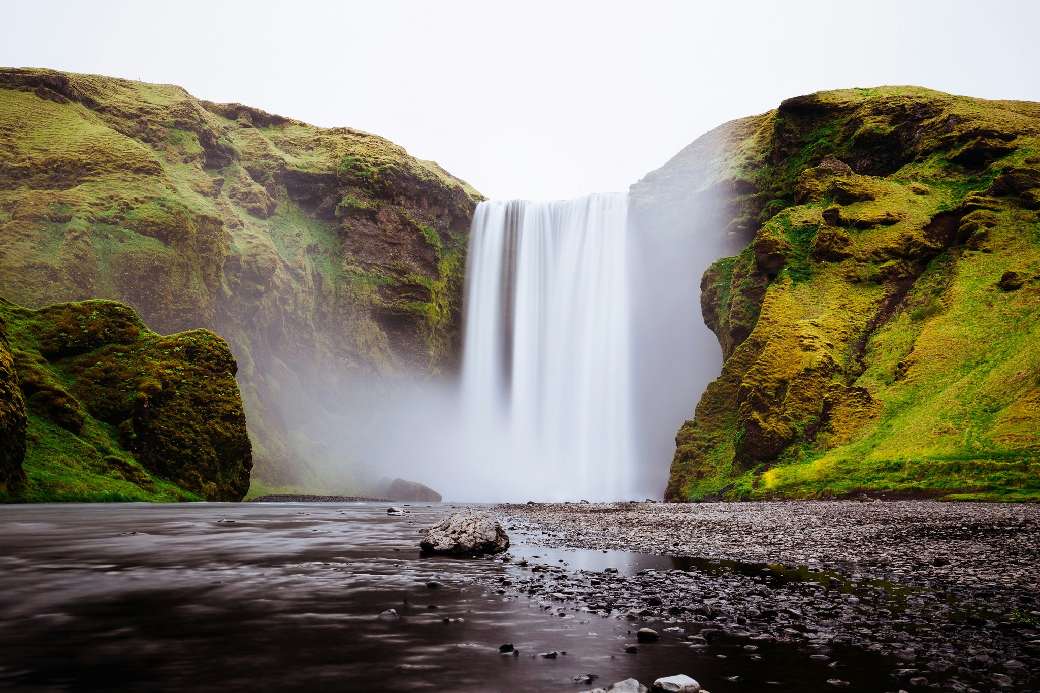 Powerful Skógafoss Waterfall plunging into a misty pool in South Iceland.