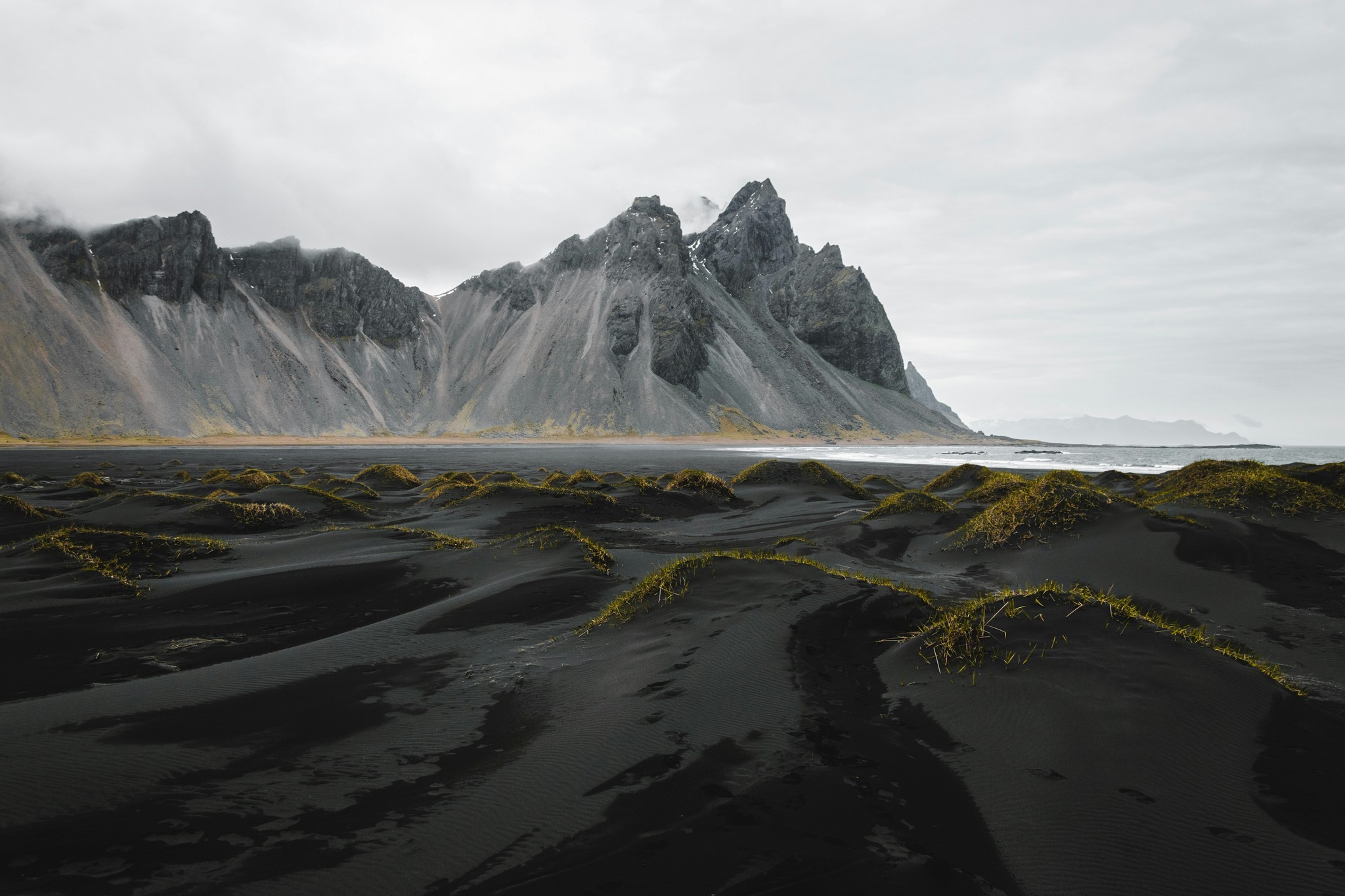 Vestrahorn Mountain rising behind the black sand beach at Stokksnes, Iceland.