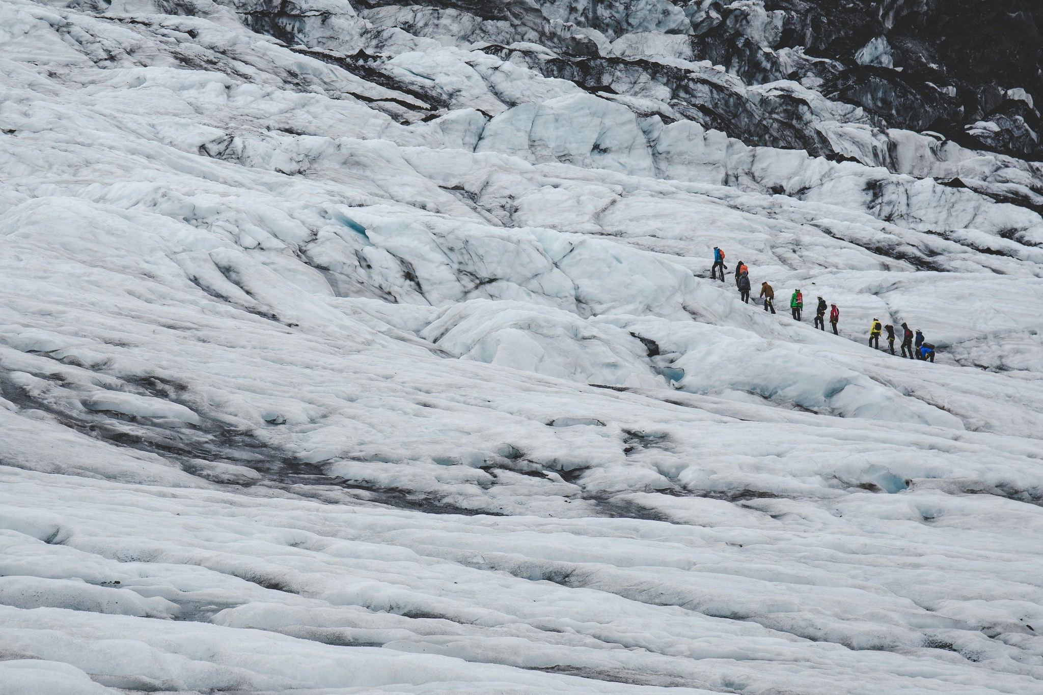 A group of people hiking on Vatnajökull Glacier in Iceland.