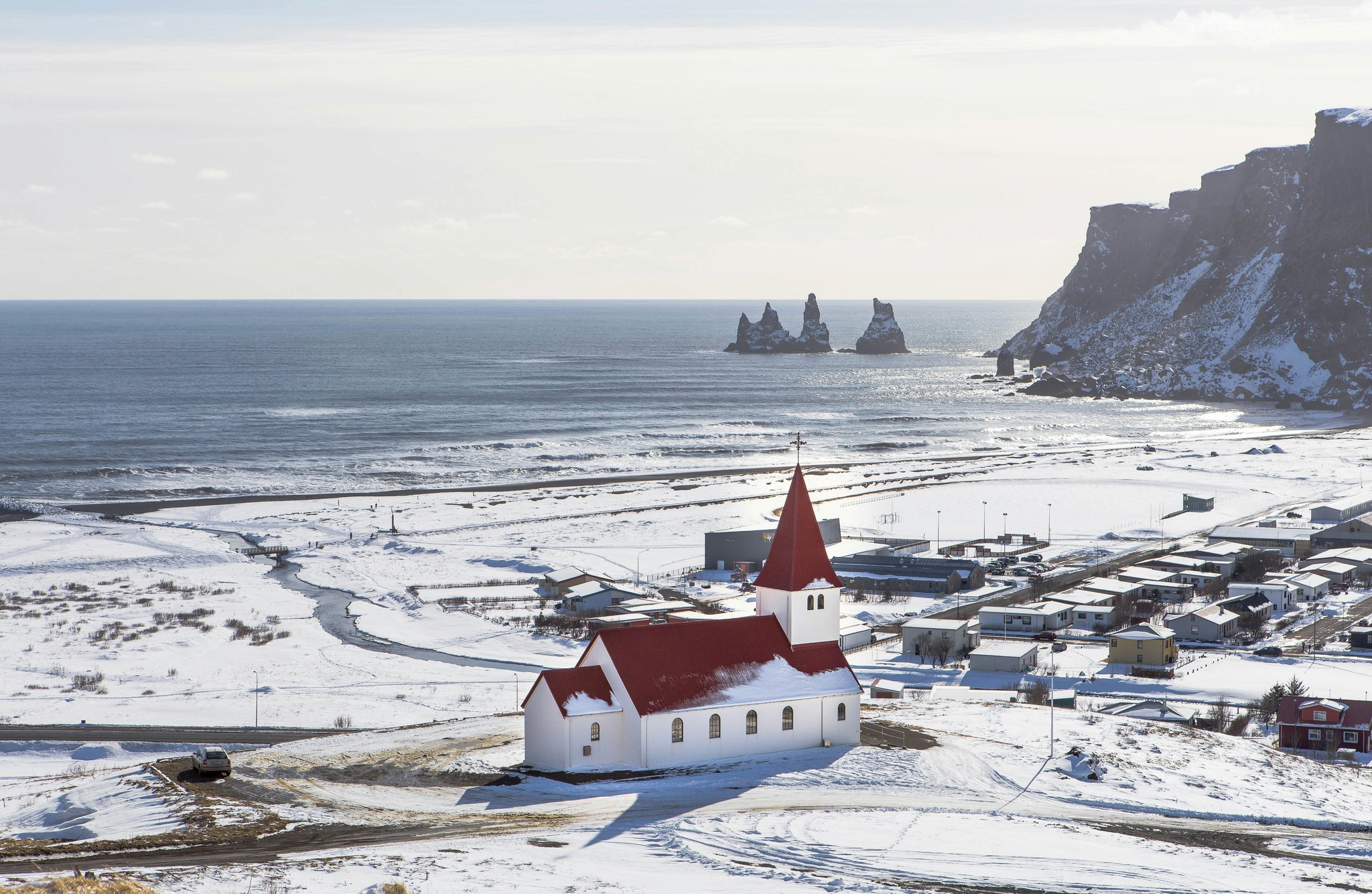 Vík í Mýrdal covered in snow during winter.